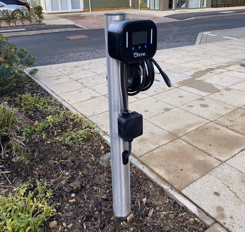 Ohme Charger installed on a steel post.